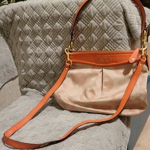 Beautiful cloth Coach purse.  Medium sized, peach and tan colored.